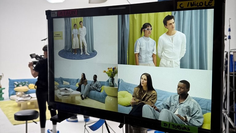 High-definition filming monitor displaying diverse models and scenes for fashion and lifestyle shoots, capturing behind-the-scenes moments on set.